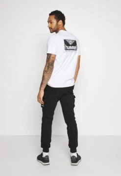 YOURTURN Unisex - Trainingsbroek - Black -Heren Mode Boutique 37e11c7cc85b4c32935b63421ffc599f